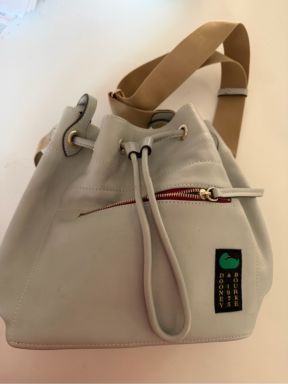 Dooney & Bourke Light Gray Bucket Shoulder Bag with Tan Strap